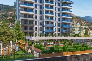 Квартира 1+1 идеально расположена в центре Алании, на улице Сугёзю (34400)