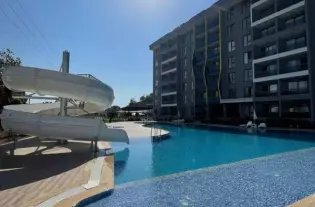 Современная квартира 1+1 в Газипаше с видом на бассейн (45600)