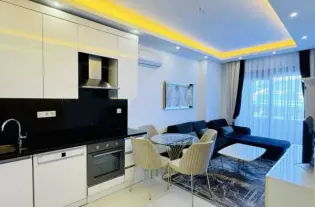 Квартира 1+1 в новом комплексе апартаментов в курортном районе Махмутлар (0320001)