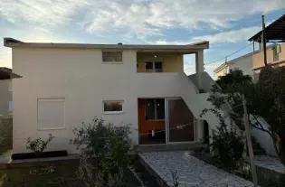 Дом с двумя автономными квартирами в Челуга