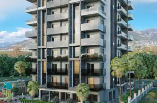 Уютные современные квартиры в жилом комплексе от застройщика в районе Махмутлар (01432)